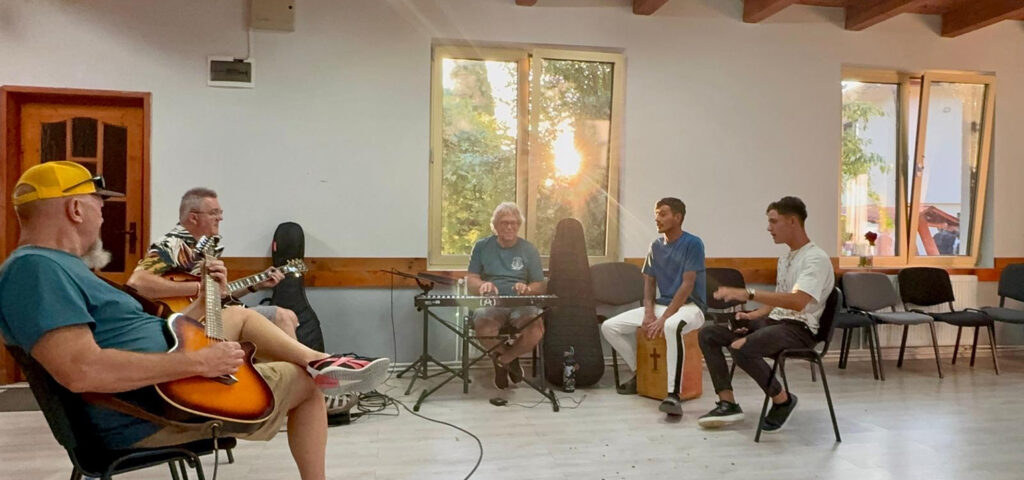 Short-term missionaries from Utah play music with some of the native kids in Romania. None of this is random.