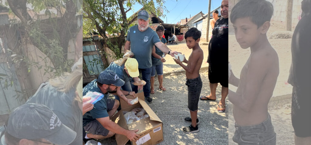Missionaries from The Rock Church handing out sack lunches to children in need at a landfill in Romania. 